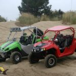 Riding UTVs in the Dunes at Coos Bay, Oregon Riding UTVs in the Dunes at Coos Bay, Oregon