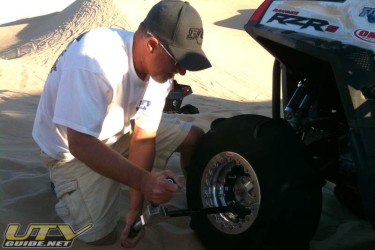Changing a tire in the dunes